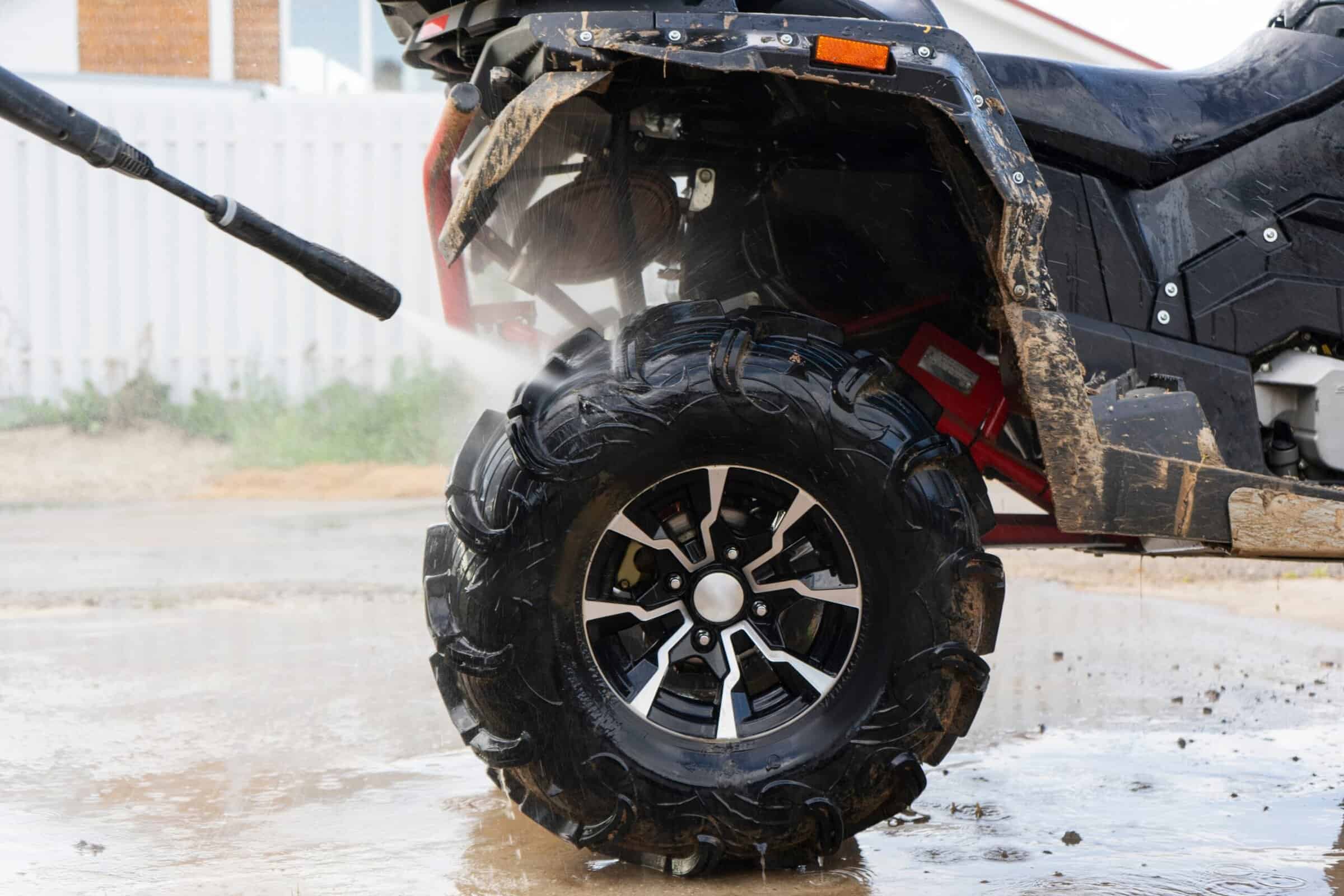 ATV covered in mud before exterior wash and deep detailing.
